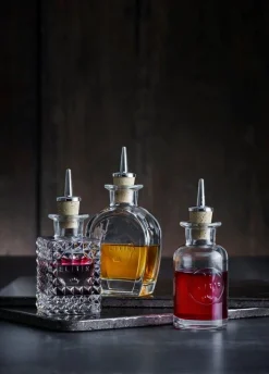 Elixir No2 flaske med skænkeprop rund 10 cl.